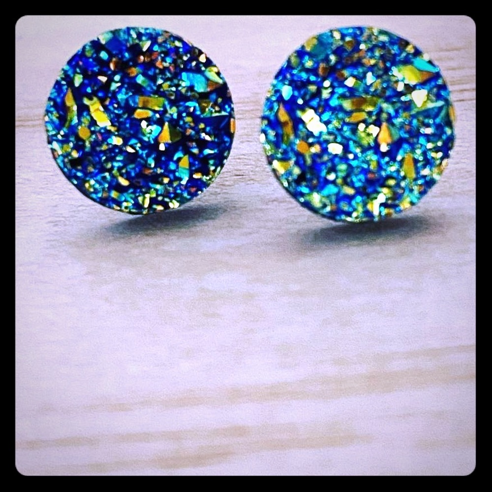 Blue reflective stud earrings.